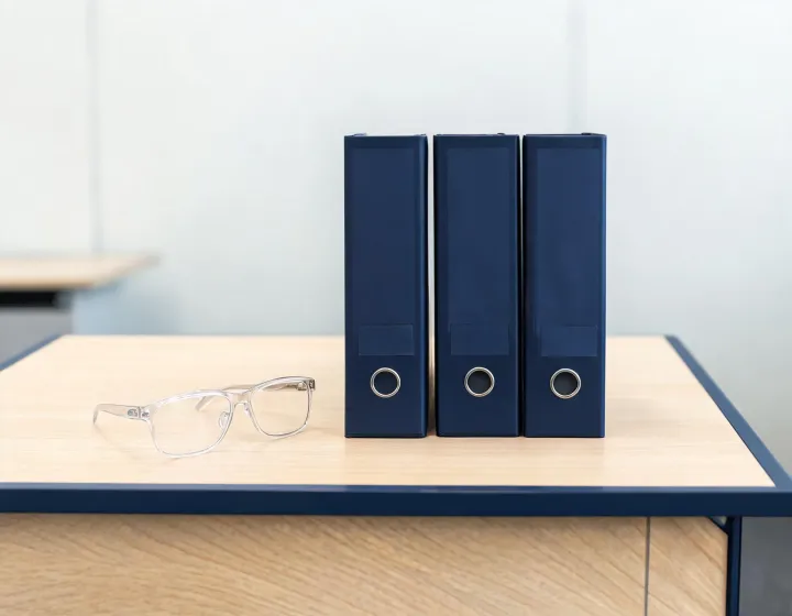 Prescription safety eyewear brief beside factory quote folders